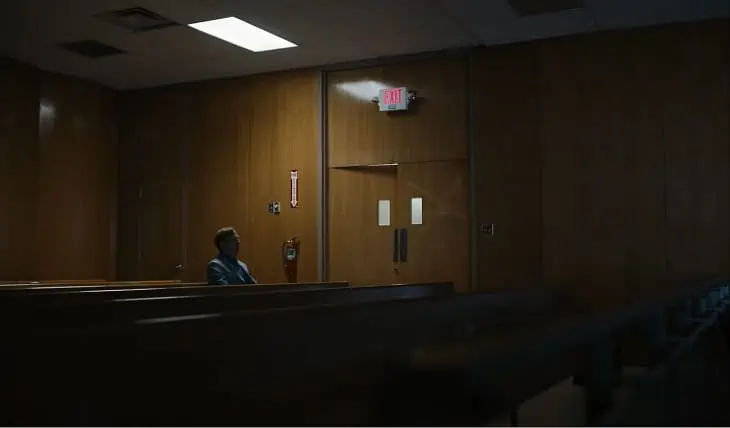 Jimmy sits in an empty courtroom