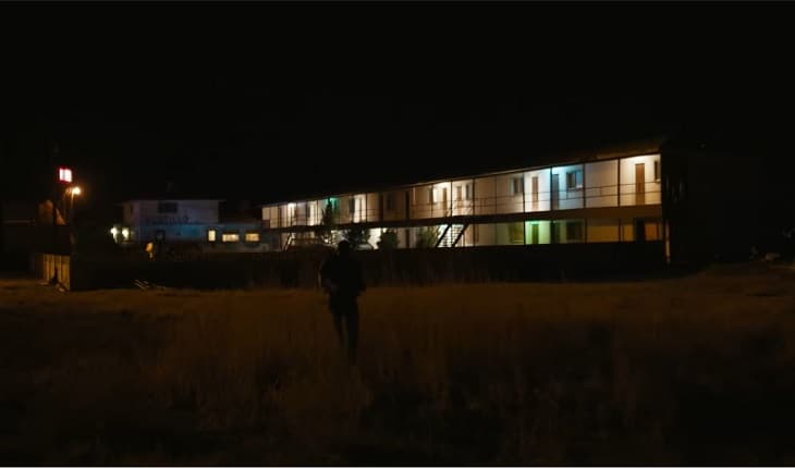 Man running to Ocotillo Motel at night