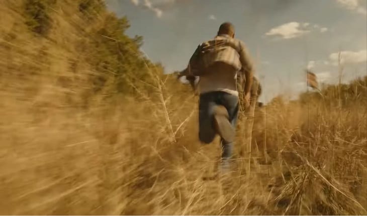 Man sprinting through dead weeds