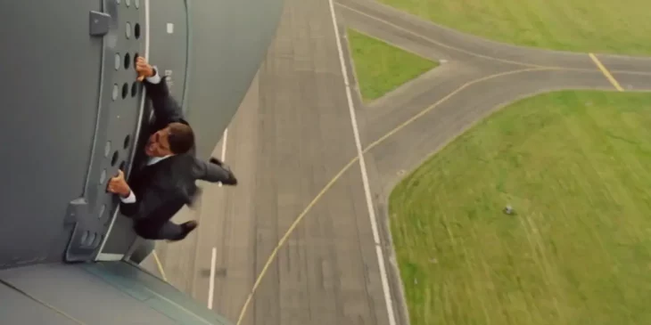 Tom Cruise hanging from a plane in Mission: Impossible - Rogue Nation