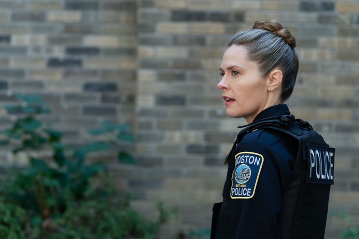 Officer in profile with Boston Police patch visible
