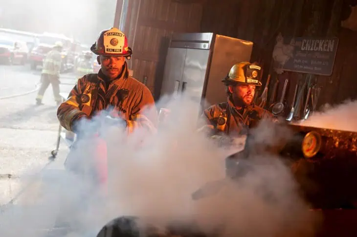 Fire Country S4E6: Wide shot of kitchen with flames at the smoker and multiple hotspots